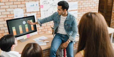 Senior manager explaining company targets to employees